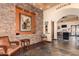 Elegant interior entryway with stone accents, artwork, and a glimpse into the terrace dining area at 28933 N Saddle Way, San Tan Valley, AZ 85143