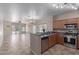 Well-equipped kitchen with stainless steel appliances and a convenient breakfast bar at 28933 N Saddle Way, San Tan Valley, AZ 85143