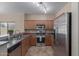 Updated kitchen with stainless steel appliances and ample cabinet space at 28933 N Saddle Way, San Tan Valley, AZ 85143