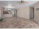 Spacious open-plan living room featuring tile flooring and modern lighting at 28933 N Saddle Way, San Tan Valley, AZ 85143