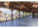 Outdoor pavilion featuring golf course views, overhead lighting, and ceiling fans for community gatherings at 28933 N Saddle Way, San Tan Valley, AZ 85143