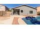 Backyard showcases a pool with a protective fence and access to the covered patio at 28933 N Saddle Way, San Tan Valley, AZ 85143