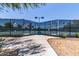 Well-maintained community tennis courts enclosed with fencing, offering a recreational space for residents at 28933 N Saddle Way, San Tan Valley, AZ 85143