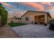 Outdoor patio with ambient string lights illuminating a backyard with an evening sky at 3010 W Laredo Ln, Phoenix, AZ 85085