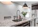 Kitchen island featuring a stainless steel sink and granite countertops at 3010 W Laredo Ln, Phoenix, AZ 85085