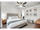 Cozy main bedroom with a cushioned headboard, carpeted floors, and ensuite bathroom entrance at 3010 W Laredo Ln, Phoenix, AZ 85085