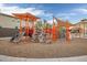 Community playground with colorful climbing structures, slides, and shaded areas for outdoor fun at 3010 W Laredo Ln, Phoenix, AZ 85085