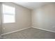 Neutral bedroom with carpet, window, and ample natural light at 30508 W Clarendon Ave, Buckeye, AZ 85396