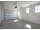 Bright garage with natural light, space for parking, and durable flooring at 30508 W Clarendon Ave, Buckeye, AZ 85396