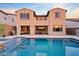 Stunning backyard with a sparkling pool, covered patio, and outdoor seating area, perfect for entertaining at 31106 N 138Th Ave, Peoria, AZ 85383