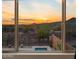 Picture window view of backyard pool and desert landscape at 31106 N 138Th Ave, Peoria, AZ 85383