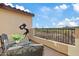 Enjoy scenic views from this cozy balcony with comfortable seating and a telescope at 31106 N 138Th Ave, Peoria, AZ 85383