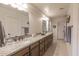 Bathroom showcasing double vanity with granite countertops, undermount sinks, and tile flooring at 31106 N 138Th Ave, Peoria, AZ 85383