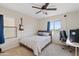 Cozy bedroom with carpet, ceiling fan, and window overlooking the desert at 31106 N 138Th Ave, Peoria, AZ 85383