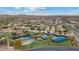 Aerial view of a community with tennis courts, manicured lawns, and desert landscaping at 31106 N 138Th Ave, Peoria, AZ 85383