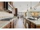 Modern kitchen with stainless steel appliances, granite countertops, and ample cabinet space at 31106 N 138Th Ave, Peoria, AZ 85383