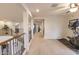 Upstairs landing area with a ceiling fan and exercise equipment at 31106 N 138Th Ave, Peoria, AZ 85383