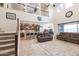 Open-concept living room with high ceilings, connecting living, dining, and kitchen areas at 31106 N 138Th Ave, Peoria, AZ 85383