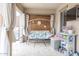Covered patio with a bench swing, grill, and outdoor decor at 31106 N 138Th Ave, Peoria, AZ 85383