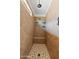 Tiled shower featuring a built-in bench, overhead shower head, and a small window at 31106 N 138Th Ave, Peoria, AZ 85383