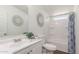 Bathroom with a white vanity, decorative wall art, and a tub shower combination at 320 E Mckellips Rd # 166, Mesa, AZ 85201