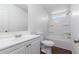 Bathroom featuring a white vanity and a white tub shower combination at 320 E Mckellips Rd # 166, Mesa, AZ 85201