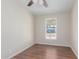 Bedroom with a window, light colored walls, and wood-look flooring at 320 E Mckellips Rd # 166, Mesa, AZ 85201