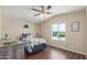 Bedroom featuring a ceiling fan, a window, and a bed with dinosaur themed bedding at 320 E Mckellips Rd # 166, Mesa, AZ 85201
