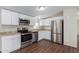 Modern kitchen featuring stainless appliances, granite counters, and white cabinets at 320 E Mckellips Rd # 166, Mesa, AZ 85201