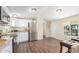 Bright kitchen with stainless steel appliances, white cabinetry, and hardwood floors at 320 E Mckellips Rd # 166, Mesa, AZ 85201