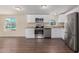 Modern kitchen featuring stainless appliances, granite counters, and white cabinets at 320 E Mckellips Rd # 166, Mesa, AZ 85201