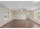 Bright, airy living room features wood floors, neutral walls, and modern ceiling fan at 320 E Mckellips Rd # 166, Mesa, AZ 85201