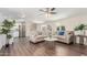 Inviting living room featuring hardwood floors, neutral walls, recessed lighting, and a ceiling fan at 320 E Mckellips Rd # 166, Mesa, AZ 85201