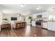 Open-concept living space with hardwood floors and contemporary kitchen, perfect for entertaining at 320 E Mckellips Rd # 166, Mesa, AZ 85201