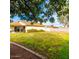 Spacious grassy backyard with gravel landscaping and block wall fencing at 3227 E Enid Ave, Mesa, AZ 85204