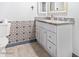 Stylish half-bathroom with designer wallpaper and granite countertop at 3227 E Enid Ave, Mesa, AZ 85204