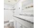 Updated bathroom with tiled walk-in shower, white vanity, and modern fixtures at 3227 E Enid Ave, Mesa, AZ 85204