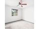 Bedroom with neutral walls, carpeting, a window, and a ceiling fan at 3227 E Enid Ave, Mesa, AZ 85204