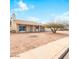 Single-story home featuring desert landscaping and mature shade trees at 3227 E Enid Ave, Mesa, AZ 85204