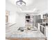 Modern kitchen island with breakfast bar, stainless steel appliances and eat-in dining space at 3227 E Enid Ave, Mesa, AZ 85204