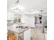 Well-appointed kitchen featuring granite countertops and white cabinetry, with open view to the living area at 3227 E Enid Ave, Mesa, AZ 85204