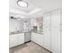 Clean kitchen with white cabinets and stainless steel appliances at 3227 E Enid Ave, Mesa, AZ 85204