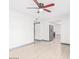 Bright living room features laminate wood floors, modern ceiling fan and fresh paint at 3227 E Enid Ave, Mesa, AZ 85204
