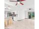 Open-concept space with tile floors, ceiling fans and kitchen access at 3227 E Enid Ave, Mesa, AZ 85204