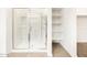 Bathroom features a modern glass-enclosed shower and practical built-in shelving at 3598 E Alexander Dr, San Tan Valley, AZ 85143