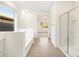Bathroom featuring a soaking tub, walk-in shower and ample natural light at 3598 E Alexander Dr, San Tan Valley, AZ 85143