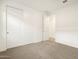 A large bedroom with a closet and a white door at 3598 E Alexander Dr, San Tan Valley, AZ 85143
