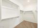 Walk-in closet with shelving and carpet, provides ample storage solutions at 3598 E Alexander Dr, San Tan Valley, AZ 85143