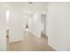 Hallway with tile flooring provides access to various rooms, promoting a spacious feel at 3598 E Alexander Dr, San Tan Valley, AZ 85143