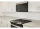 Modern kitchen with stainless steel appliances, granite countertops, and white cabinets at 3598 E Alexander Dr, San Tan Valley, AZ 85143